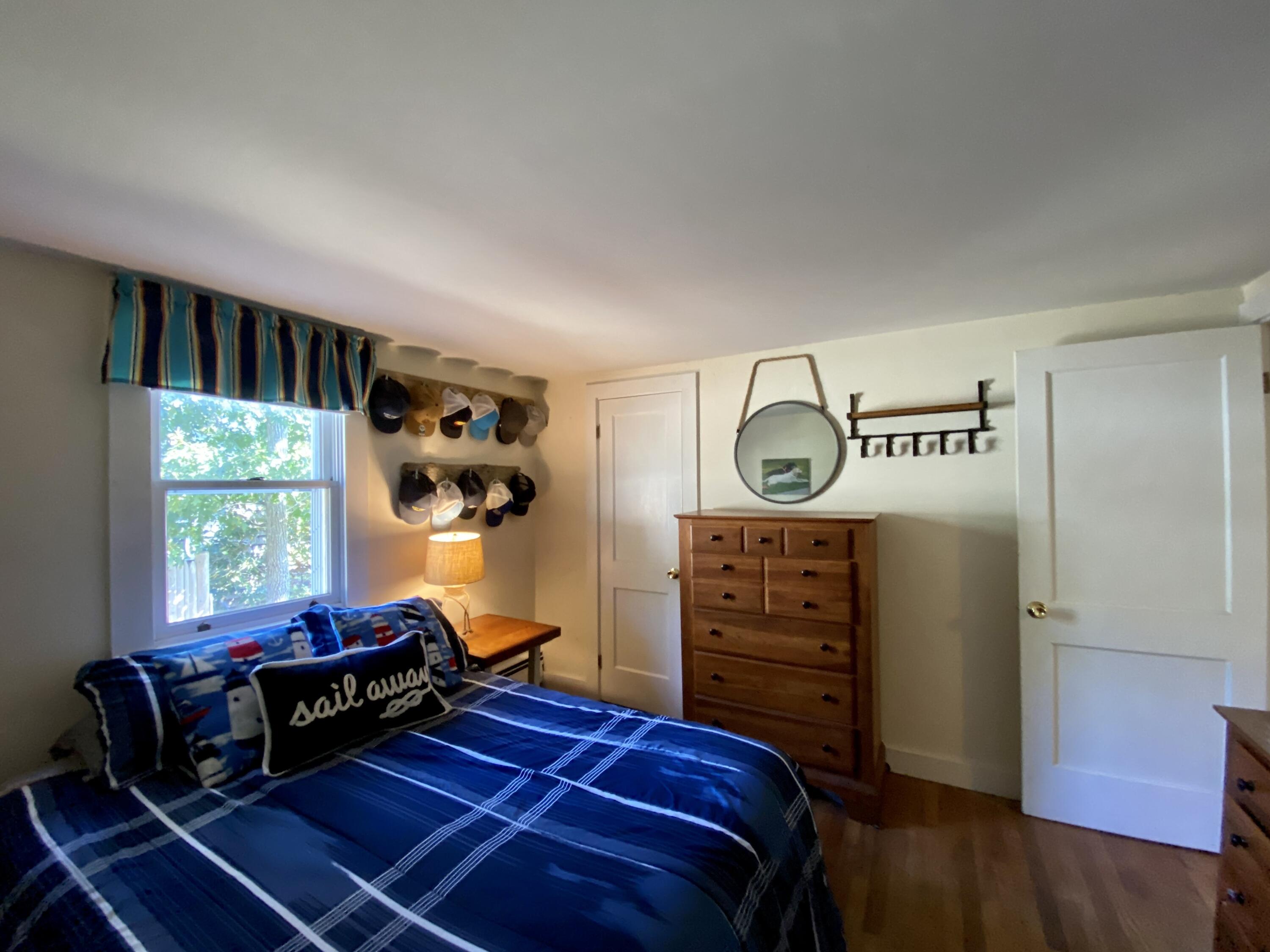 23 Naushon Road Dennis Port, MA 02639 - Photo 22 of 31 a bedroom with a bed and a window