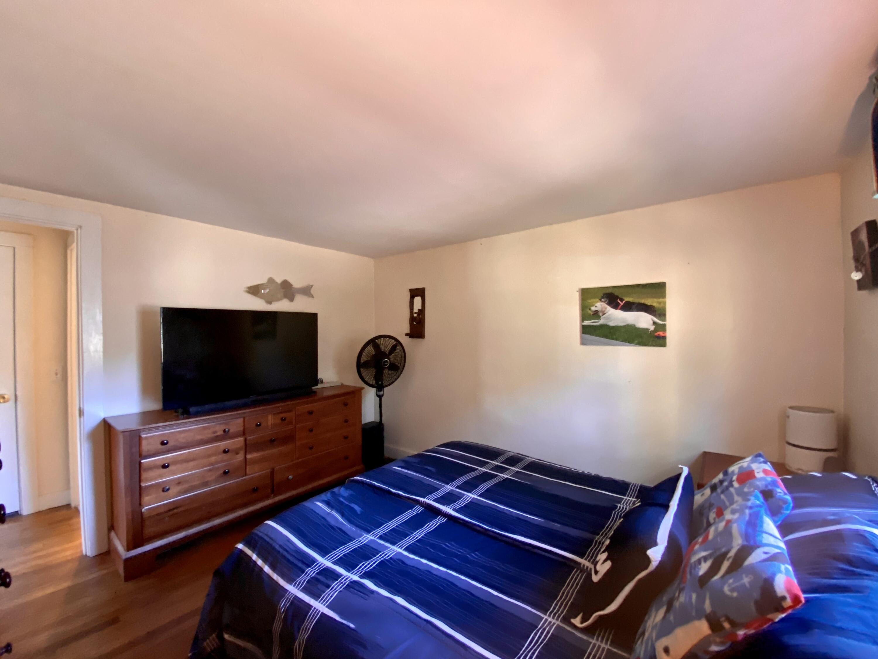 23 Naushon Road Dennis Port, MA 02639 - Photo 23 of 31 a living room with furniture and a flat screen tv