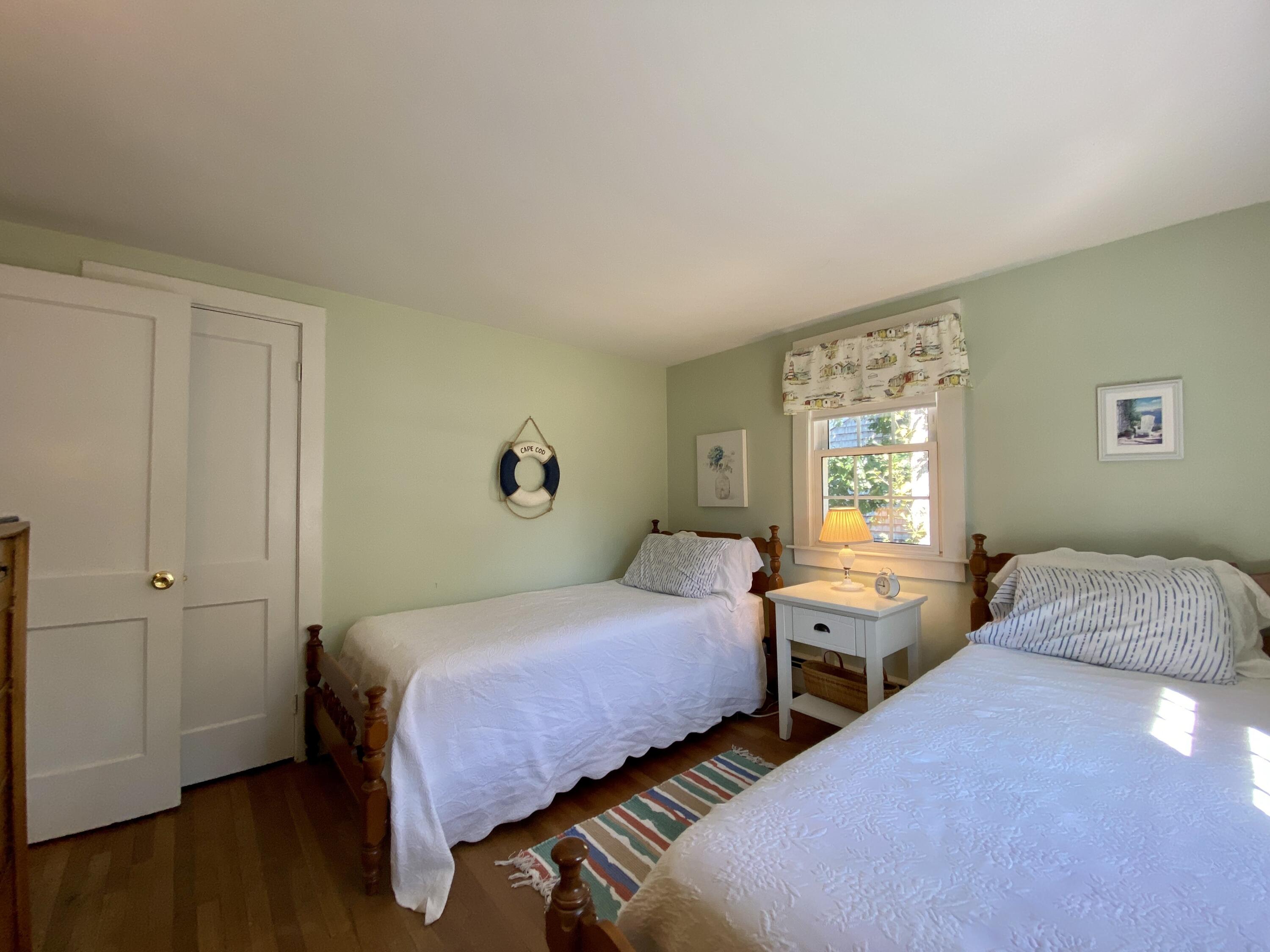 23 Naushon Road Dennis Port, MA 02639 - Photo 25 of 31 a bedroom with two beds and a window