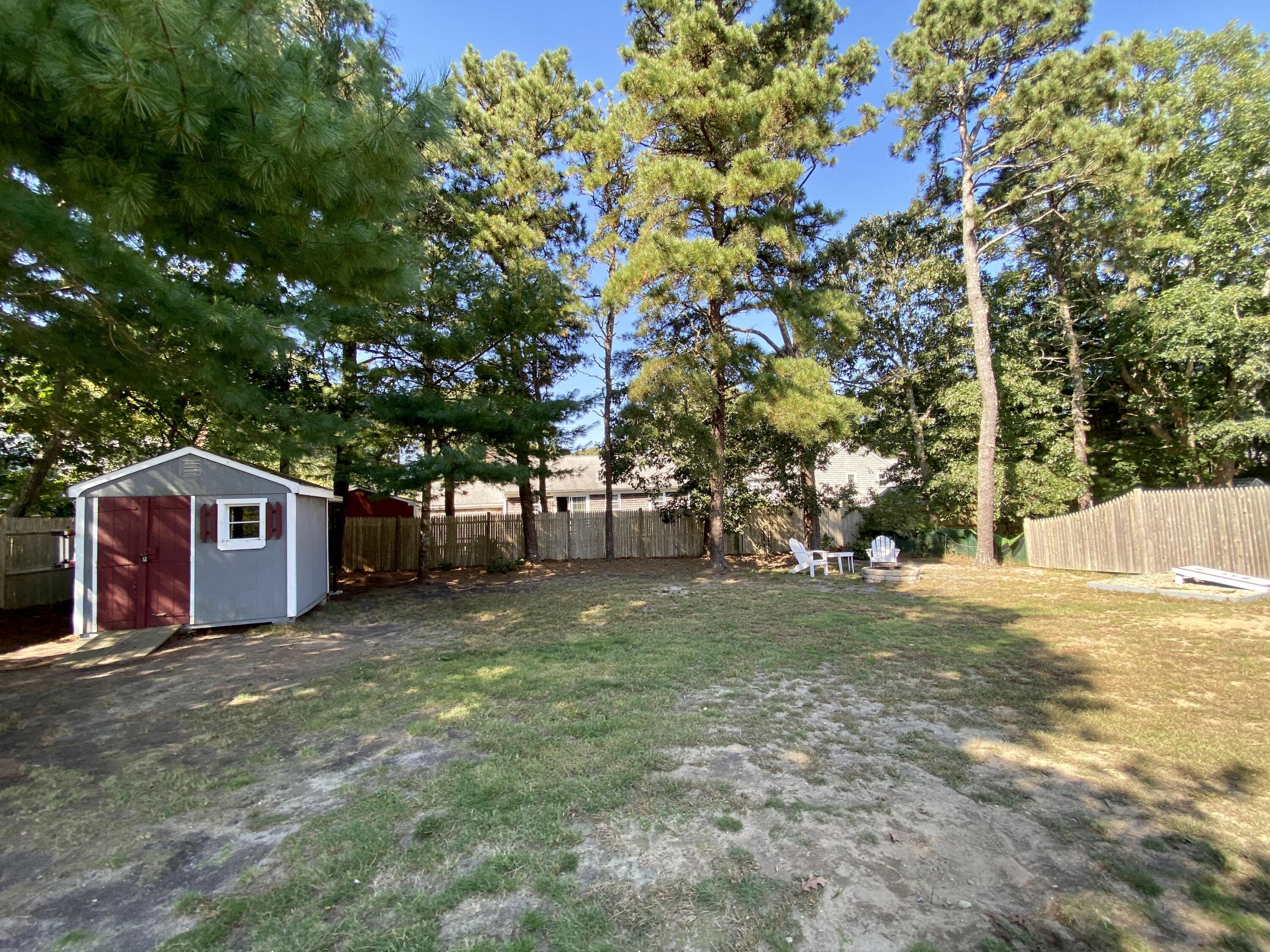23 Naushon Road Dennis Port, MA 02639 - Photo 29 of 31 a view of a yard with a house