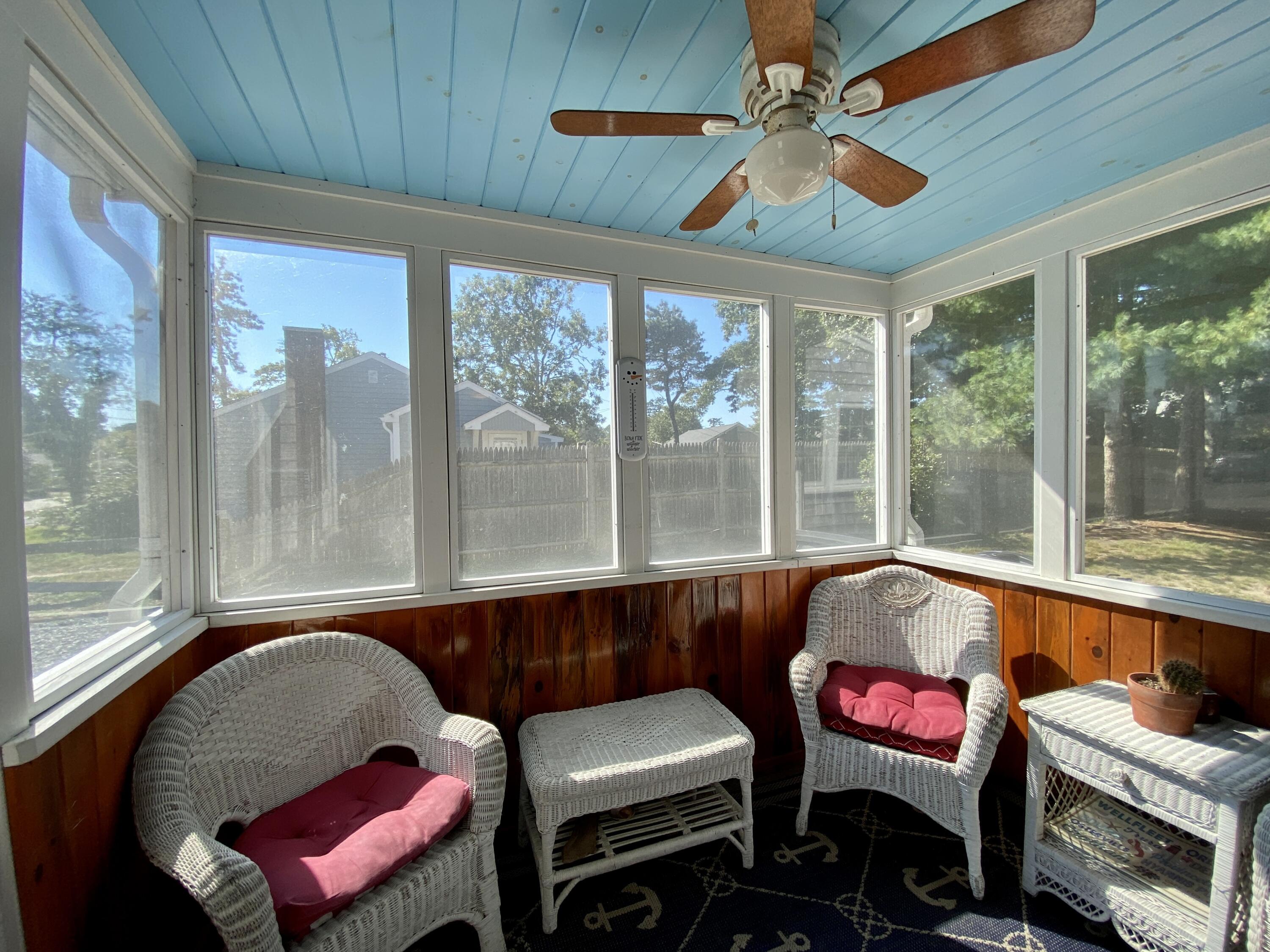 23 Naushon Road Dennis Port, MA 02639 - Photo 4 of 31 a living room with furniture and a floor to ceiling window
