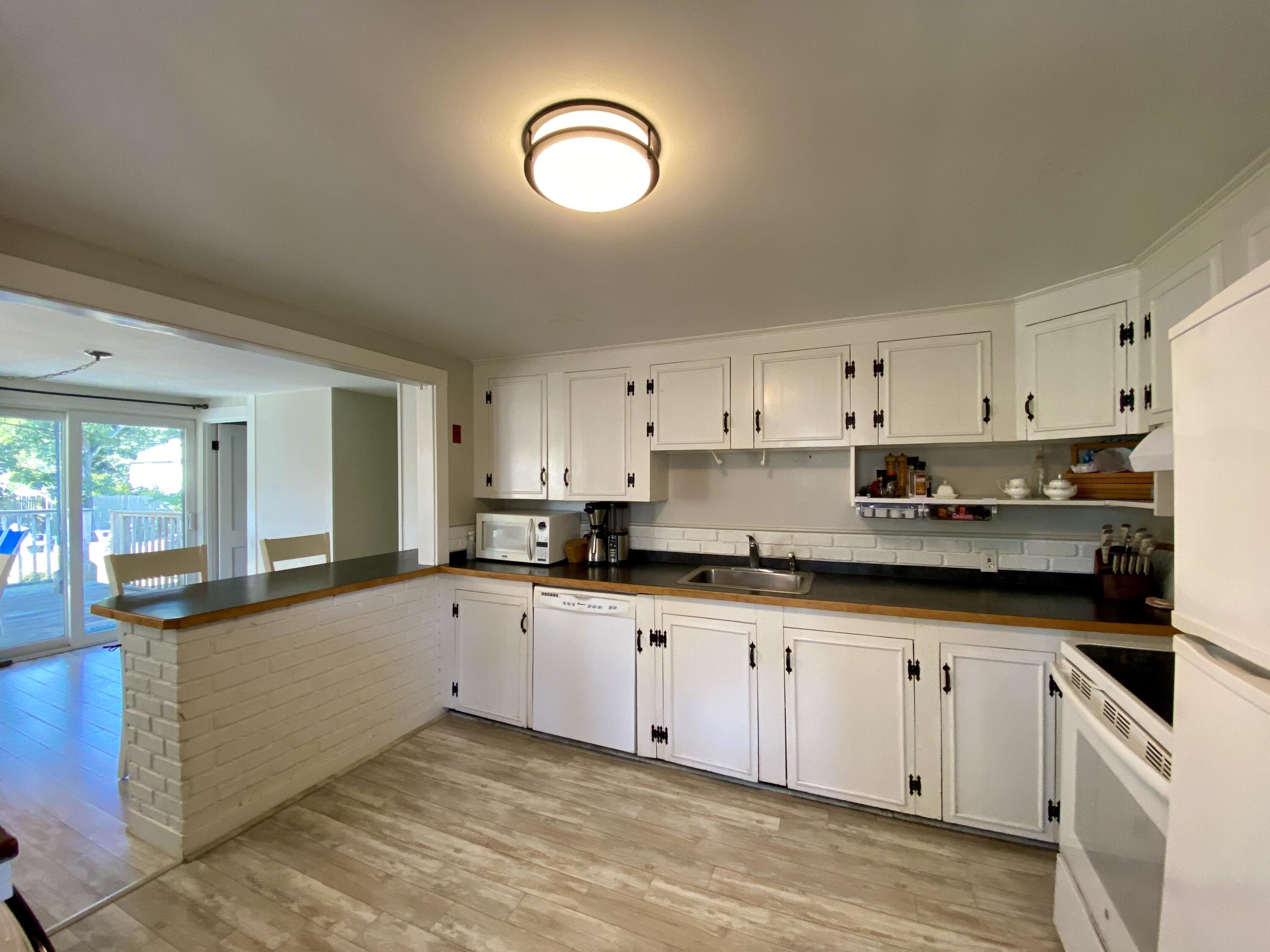 23 Naushon Road Dennis Port, MA 02639 - Photo 7 of 31 a large kitchen with cabinets