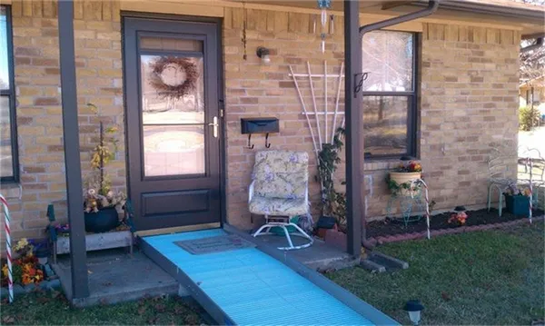 a view of a car park in front of a house