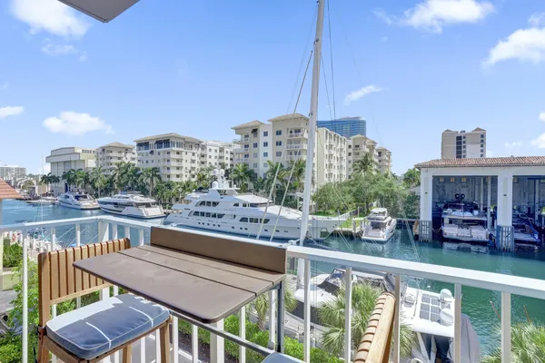 a view of a balcony with chairs