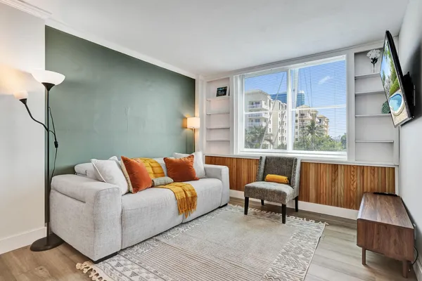 a living room with furniture and a window