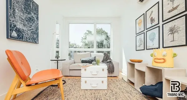 a living room with furniture and a large window