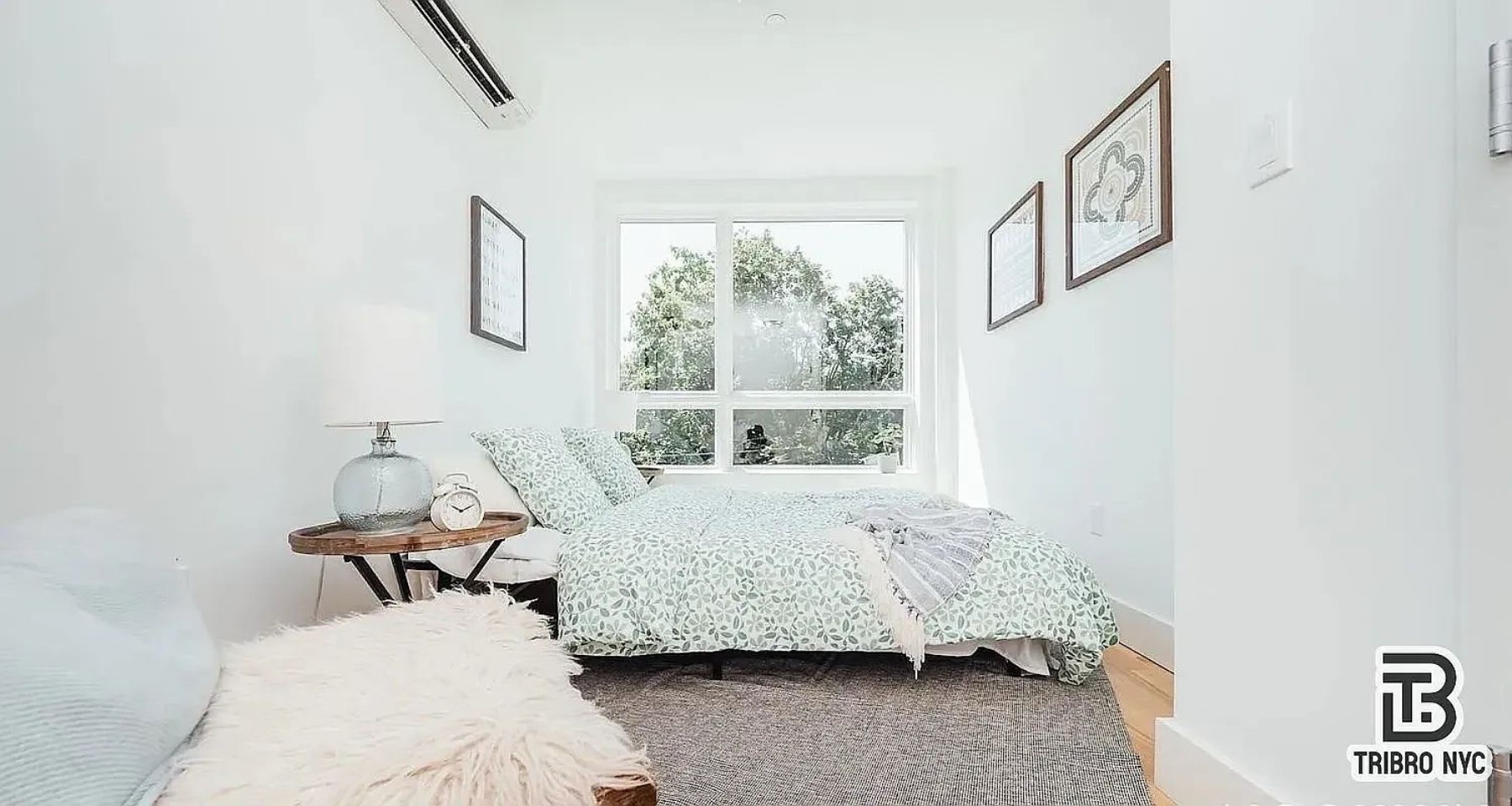 9 Cook Street, Unit 2F Brooklyn, NY 11206 - Photo 4 of 9 a bedroom with furniture and a window