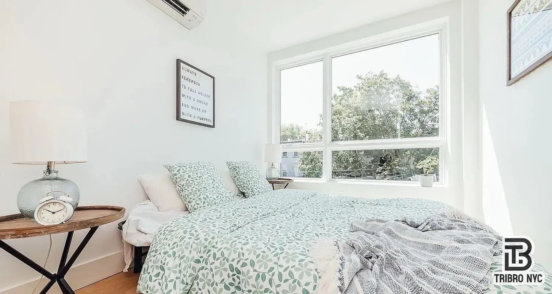 9 Cook Street, Unit 2F Brooklyn, NY 11206 - Photo 5 of 9 a bedroom with a bed and wooden floor