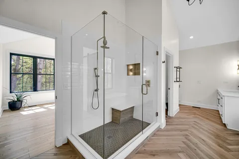 a bathroom with a shower and a tub
