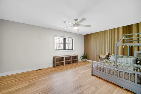 a bedroom with furniture and a window