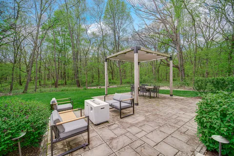a view of a table and chairs in the garden