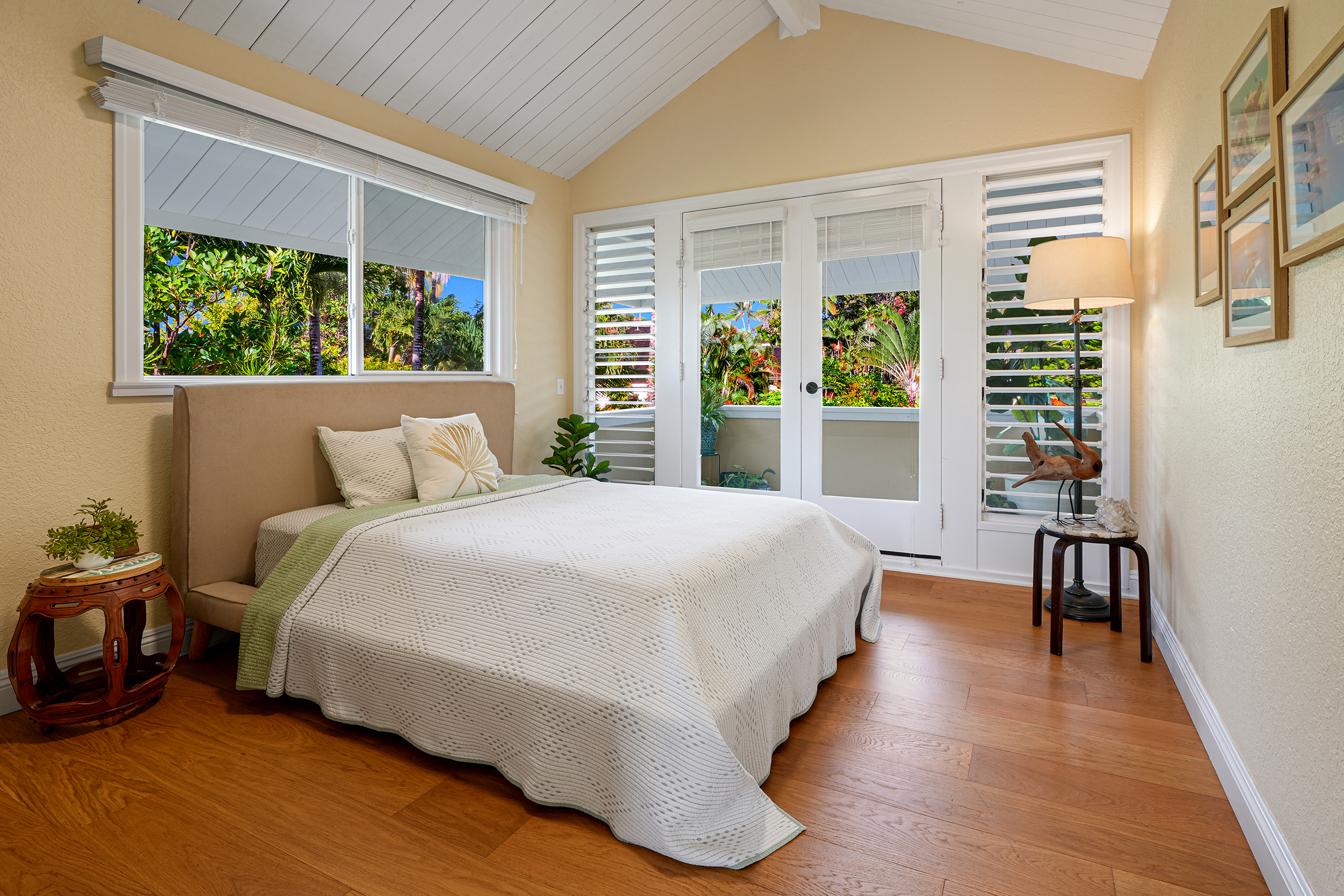 4165 Liholiho Road Princeville, HI 96722 - Photo 15 of 29 a bedroom with a large bed and a large window