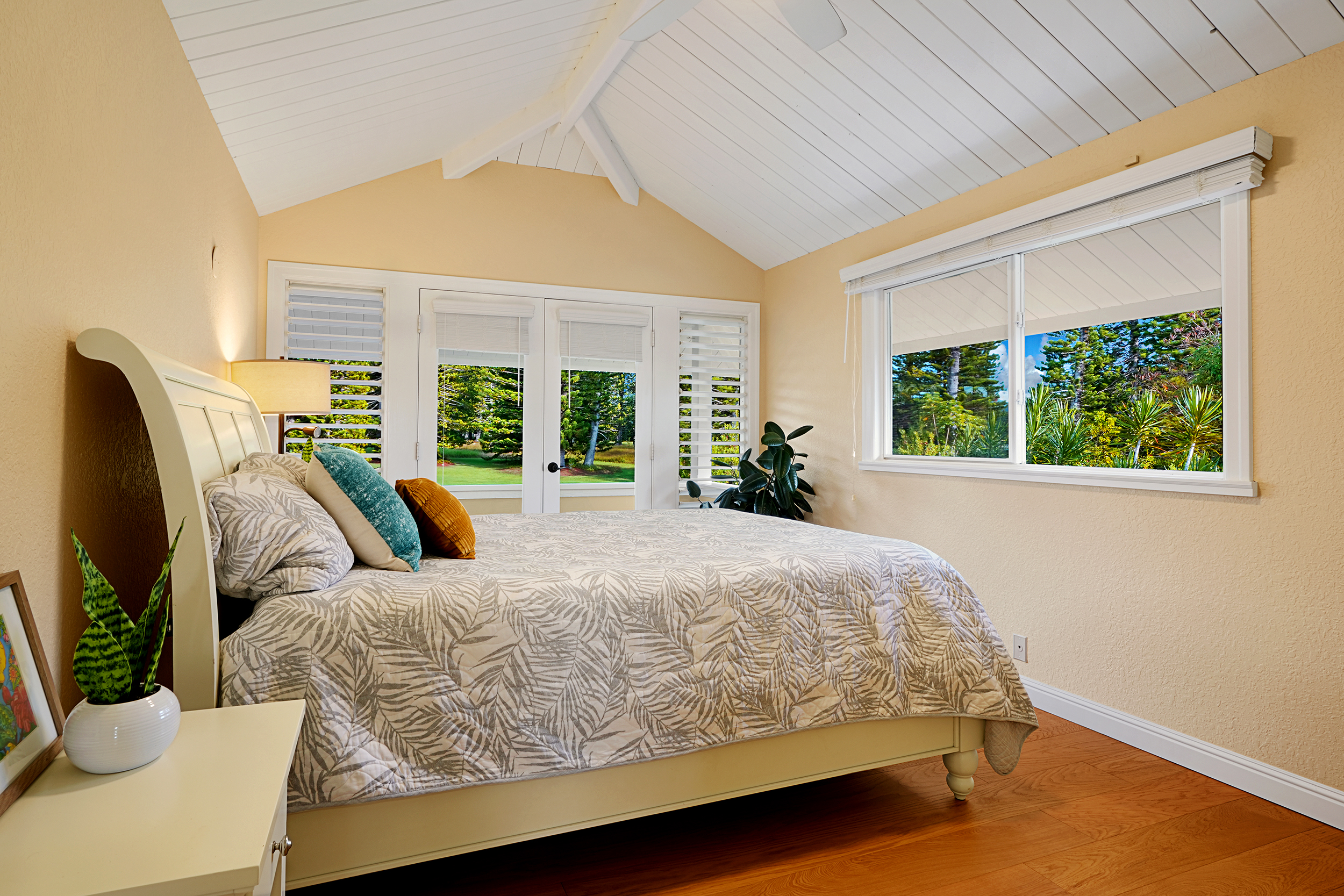 4165 Liholiho Road Princeville, HI 96722 - Photo 17 of 29 a bed sitting in a bedroom next to a window
