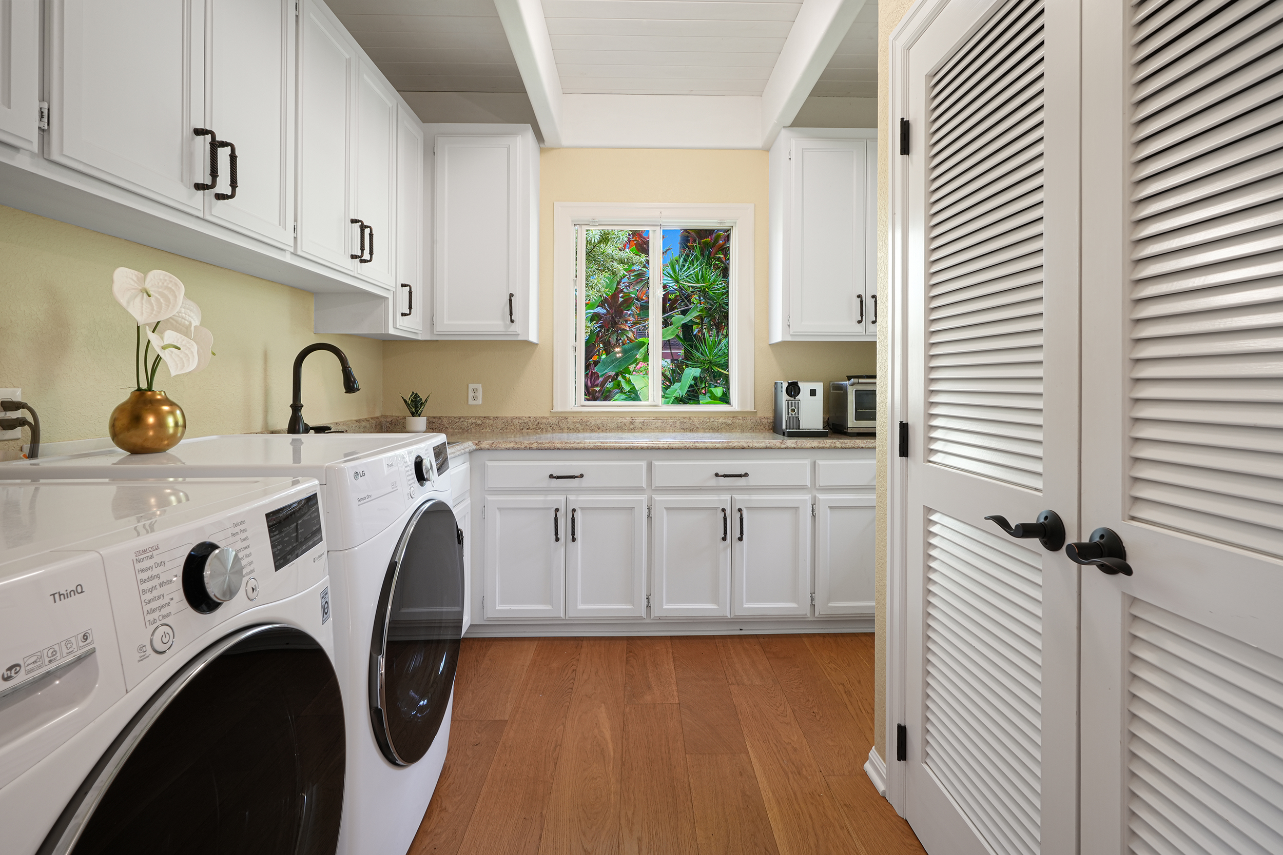 4165 Liholiho Road Princeville, HI 96722 - Photo 18 of 29 a kitchen with a sink a stove and cabinets