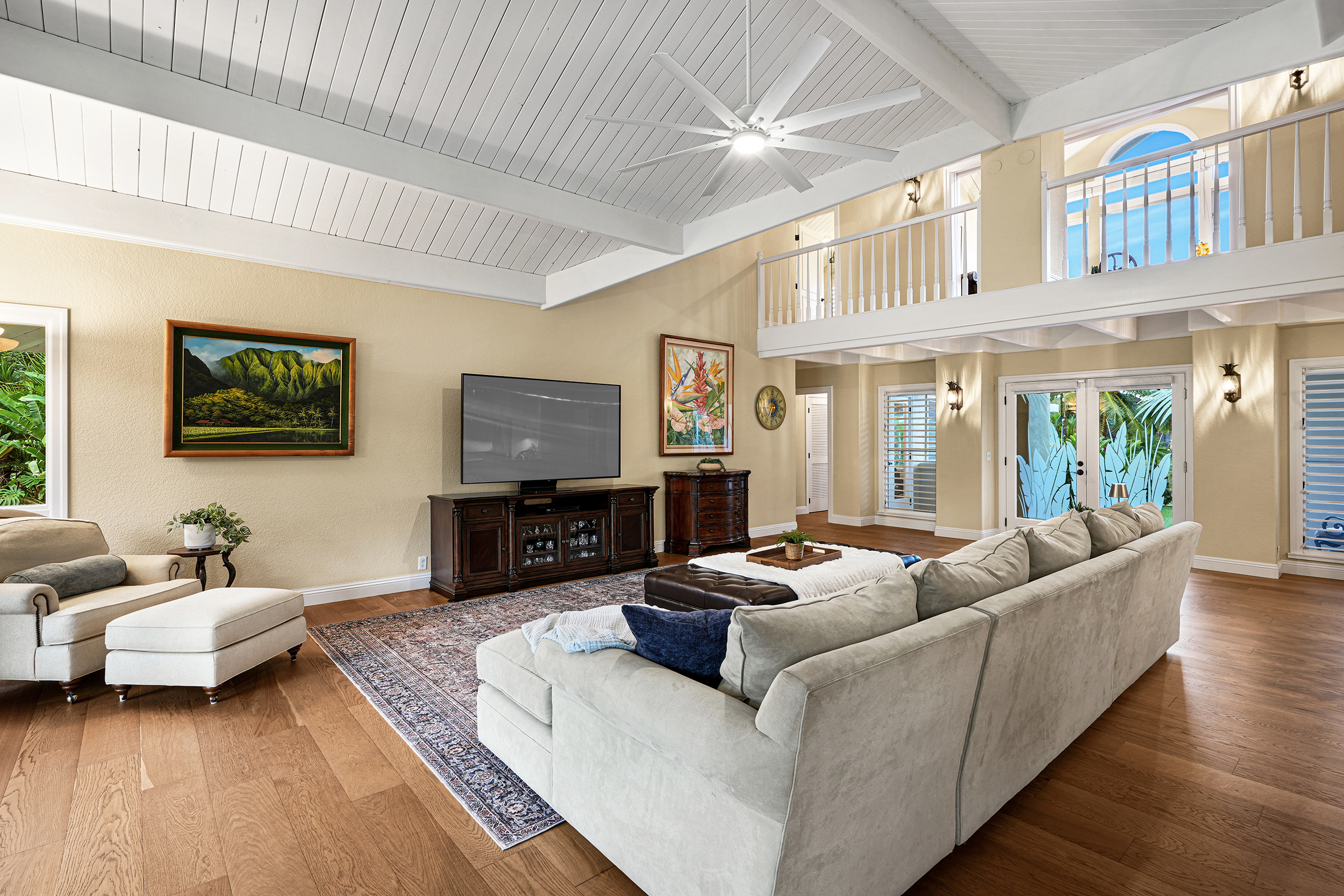 4165 Liholiho Road Princeville, HI 96722 - Photo 5 of 29 a living room with furniture and a flat screen tv