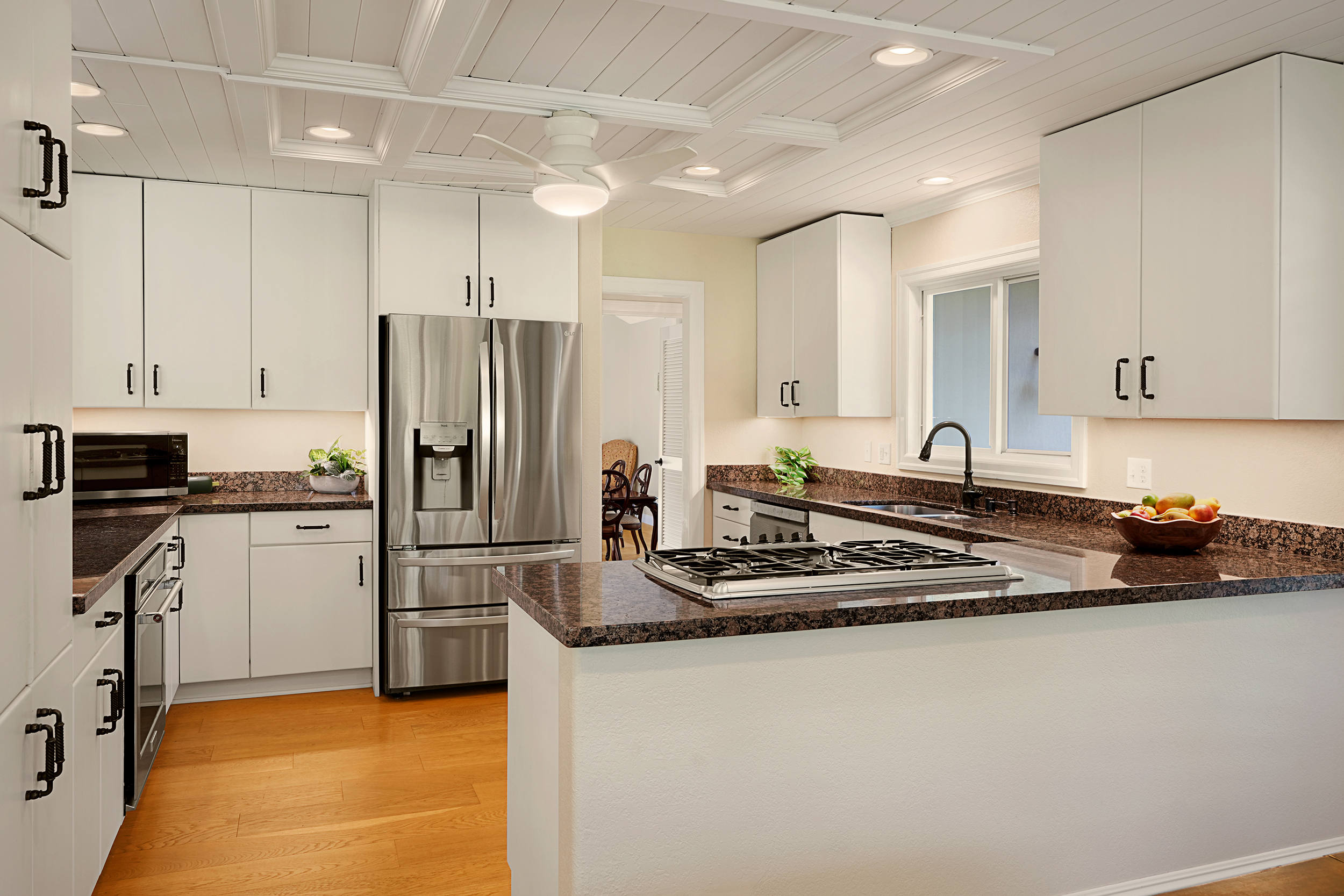 4165 Liholiho Road Princeville, HI 96722 - Photo 10 of 28 a kitchen with kitchen island a counter top space a sink stainless steel appliances and cabinets