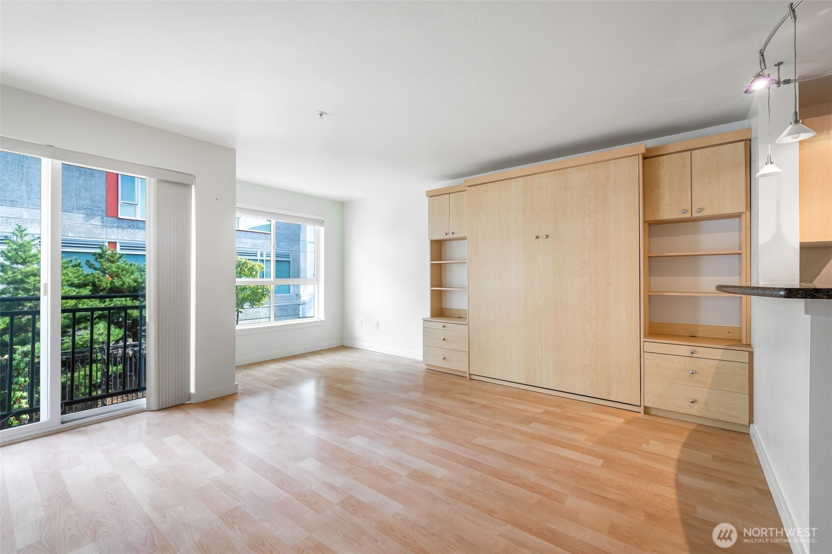 108 5th Avenue South, Unit 720 Seattle, WA 98104 - Photo 11 of 23 wooden floor in an empty room with a window