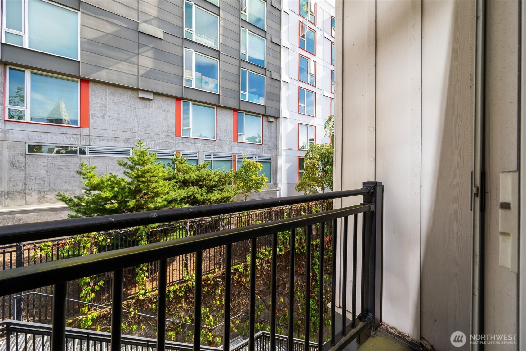 108 5th Avenue South, Unit 720 Seattle, WA 98104 - Photo 15 of 23 a view of a brick building from a balcony