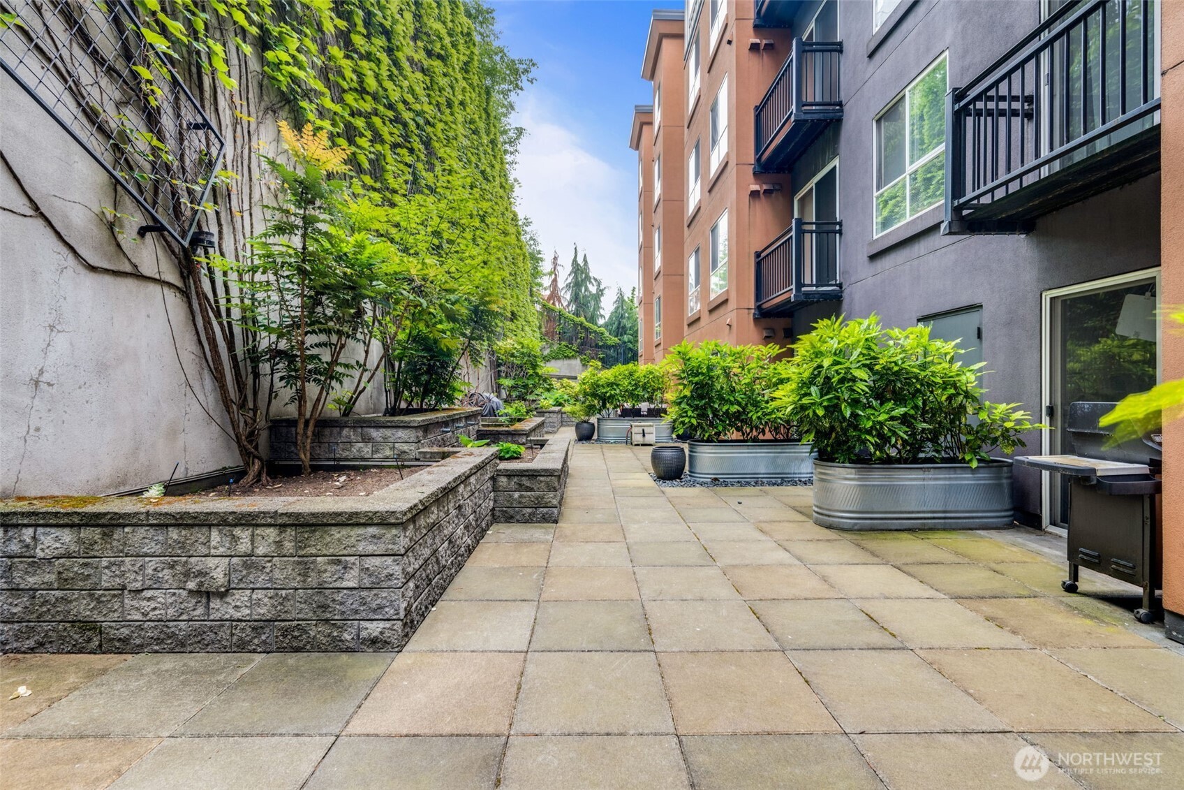 108 5th Avenue South, Unit 720 Seattle, WA 98104 - Photo 21 of 23 a view of a yard with chairs