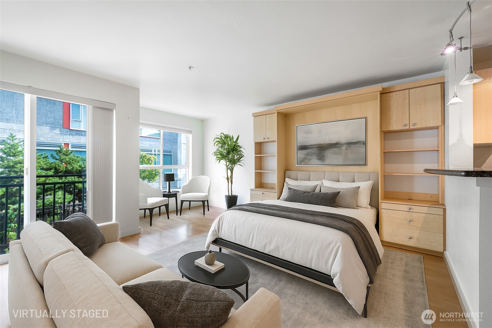 108 5th Avenue South, Unit 720 Seattle, WA 98104 - Photo 4 of 23 a bedroom with furniture and a large window