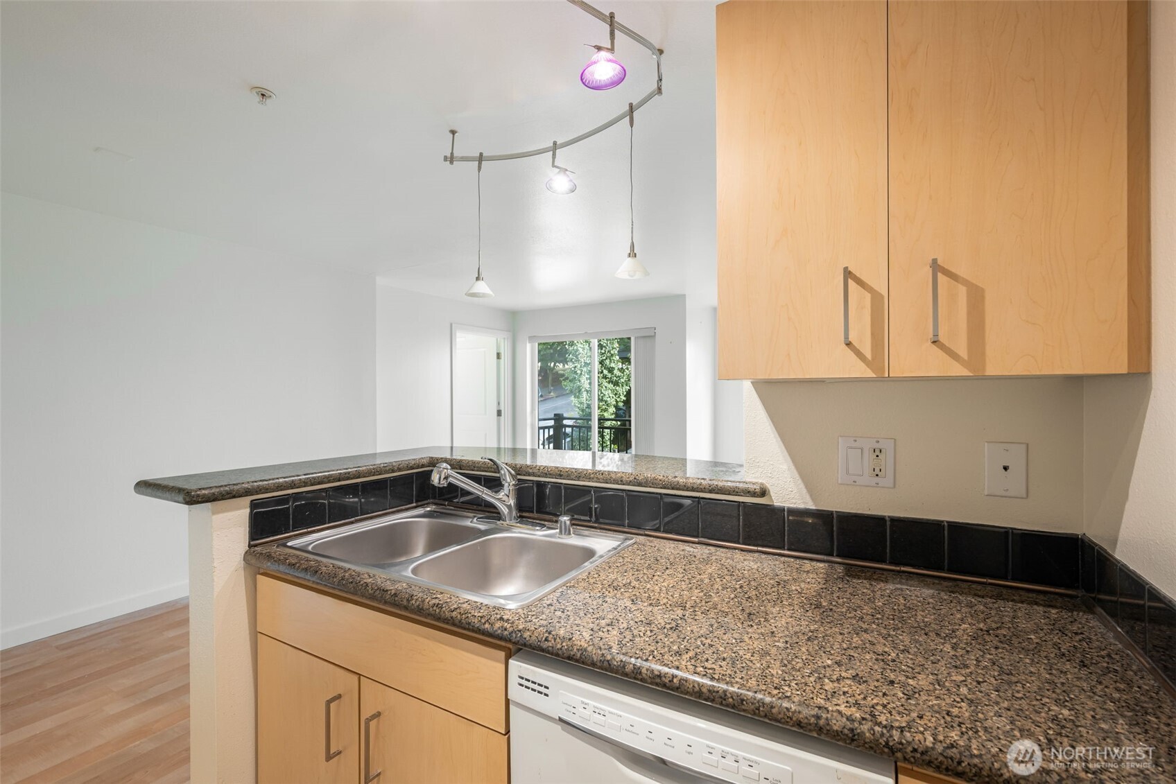 108 5th Avenue South, Unit 720 Seattle, WA 98104 - Photo 9 of 23 a kitchen with a sink and a window