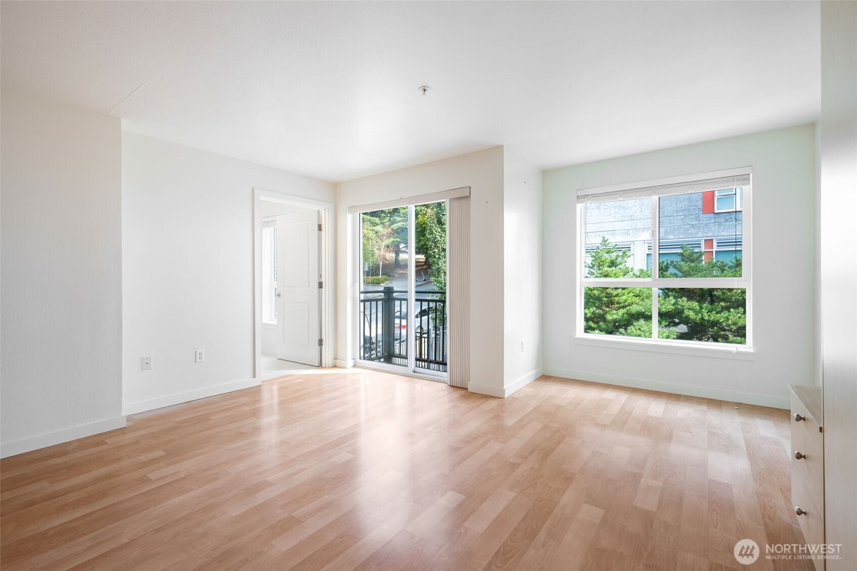 108 5th Avenue South, Unit 720 Seattle, WA 98104 - Photo 10 of 23 a view of a big room with wooden floor and windows