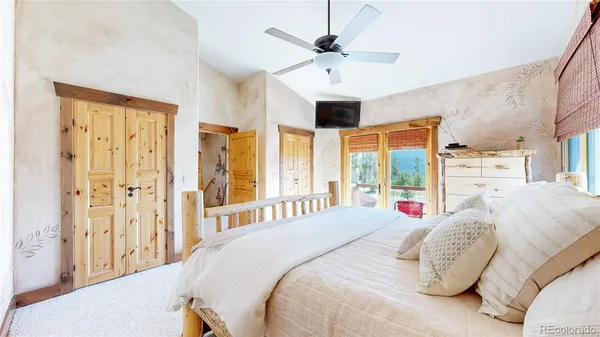 a view of a yard with potted plants and wooden fence