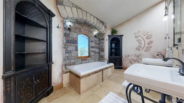 a bathroom with a sink a vanity and a mirror