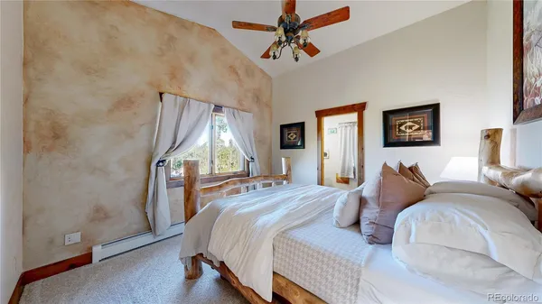 a bathroom with a sink a mirror and a shower