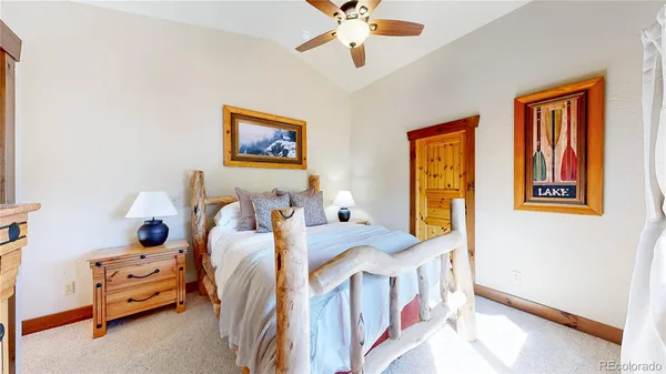 a kitchen with granite countertop a sink a stove and wooden cabinets