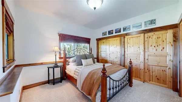 a view of a balcony with chairs and wooden floor