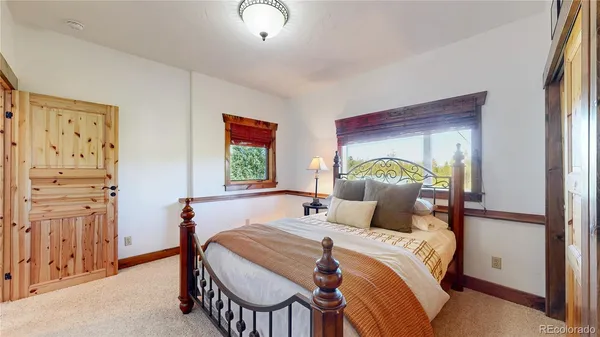 a view of a balcony with chairs and wooden floor