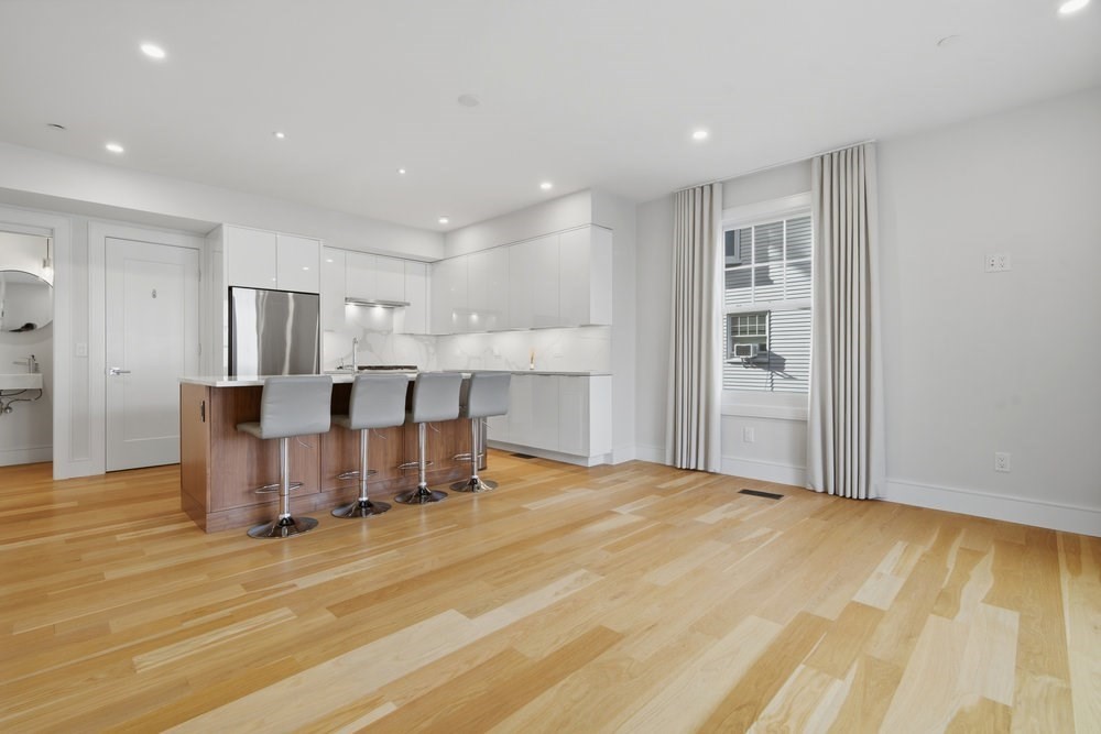 38 Englewood Avenue, Unit 2 Boston, MA 02135 - Photo 1 of 23 a large kitchen with a table and chairs