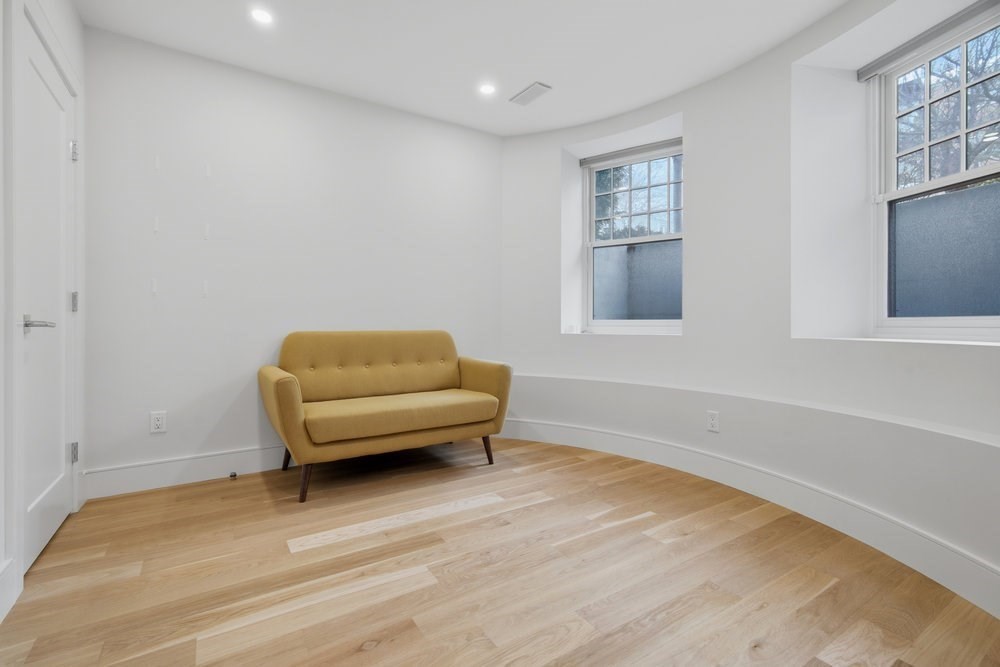 38 Englewood Avenue, Unit 2 Boston, MA 02135 - Photo 13 of 23 a living room with furniture and a wooden floor