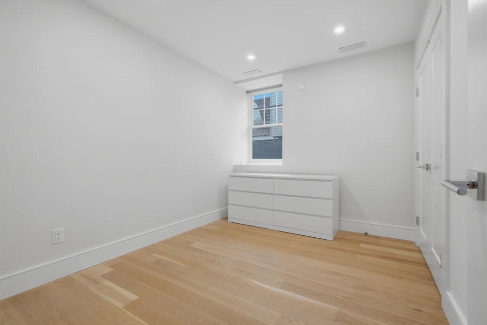 38 Englewood Avenue, Unit 2 Boston, MA 02135 - Photo 16 of 23 a room with a wooden floor and a window