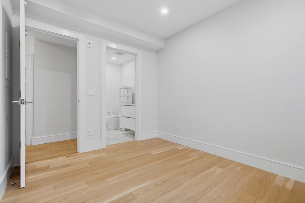 38 Englewood Avenue, Unit 2 Boston, MA 02135 - Photo 17 of 23 a view of empty room with wooden floor