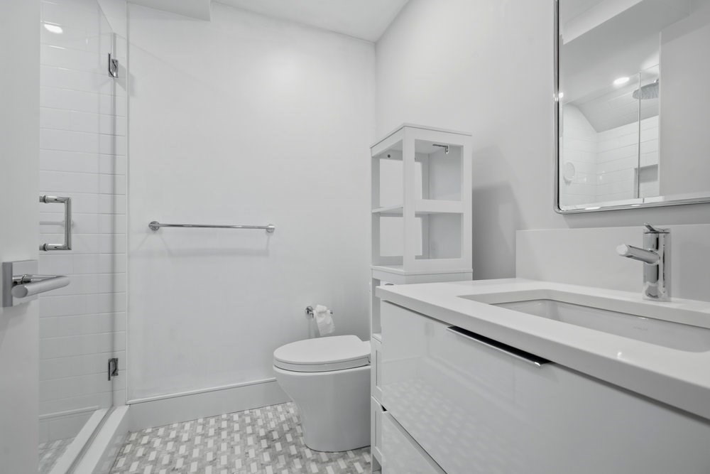 38 Englewood Avenue, Unit 2 Boston, MA 02135 - Photo 18 of 23 a bathroom with a sink a toilet and shower