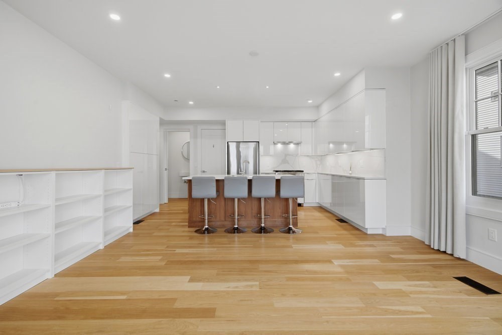 38 Englewood Avenue, Unit 2 Boston, MA 02135 - Photo 2 of 23 a view of kitchen with refrigerator cabinets and wooden floor