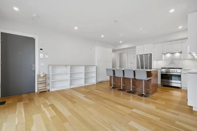 a view of a kitchen with furniture and a kitchen