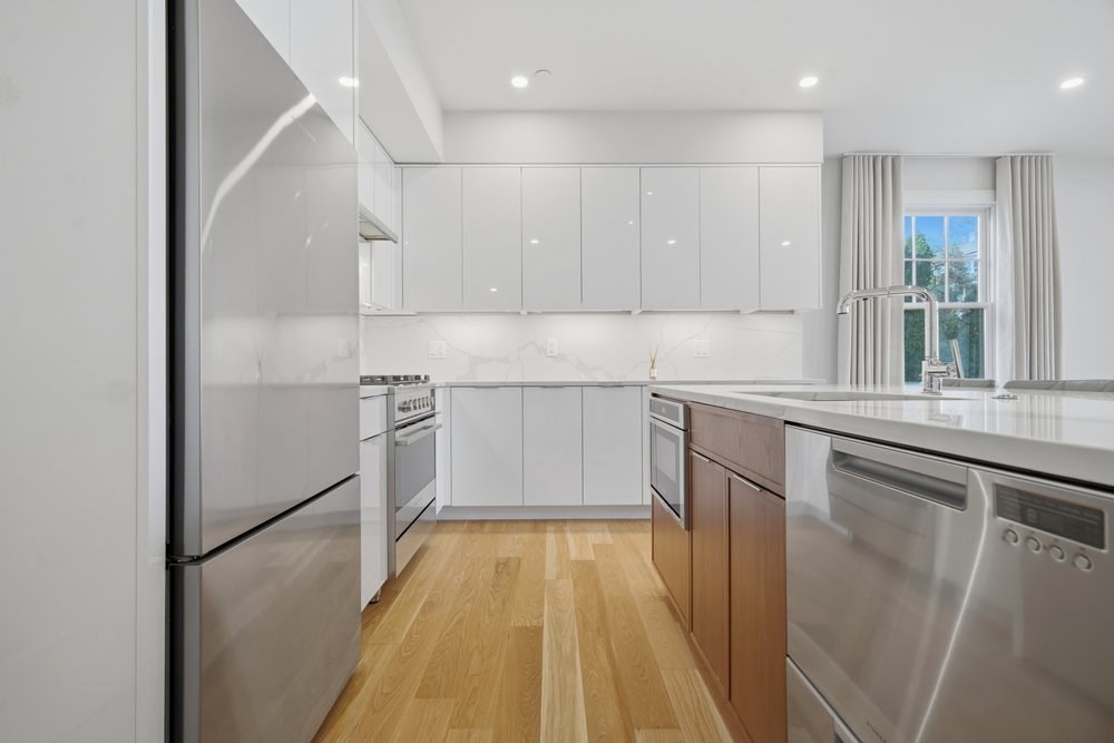 38 Englewood Avenue, Unit 2 Boston, MA 02135 - Photo 5 of 23 a kitchen with a sink a refrigerator and window