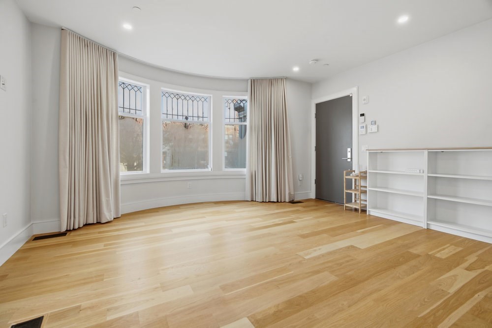 38 Englewood Avenue, Unit 2 Boston, MA 02135 - Photo 8 of 23 a view of an empty room with a window