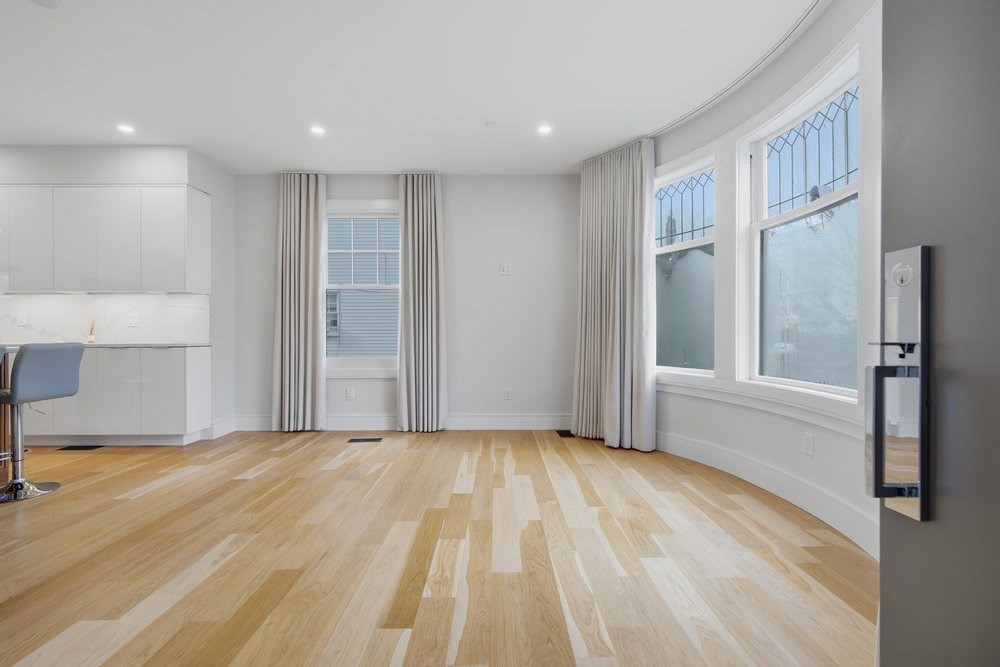 38 Englewood Avenue, Unit 2 Boston, MA 02135 - Photo 10 of 23 a view of a livingroom with a staircase