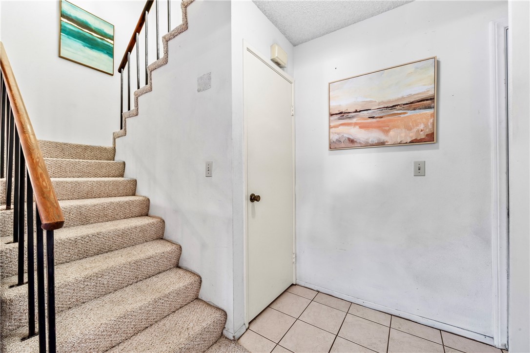 5132 West 1st Street, Unit B Santa Ana, CA 92703 - Photo 15 of 35 a view of staircase with white walls and white walls