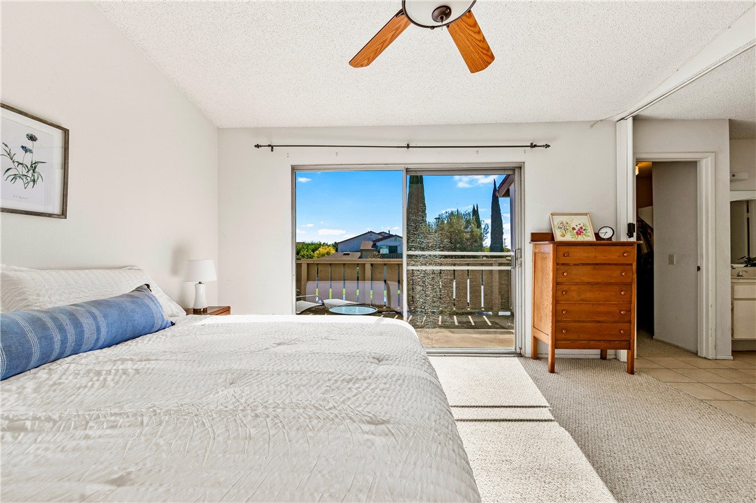 5132 West 1st Street, Unit B Santa Ana, CA 92703 - Photo 17 of 35 a bedroom with a bed and a dresser