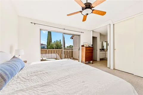 a bed room with a bed and a chandelier