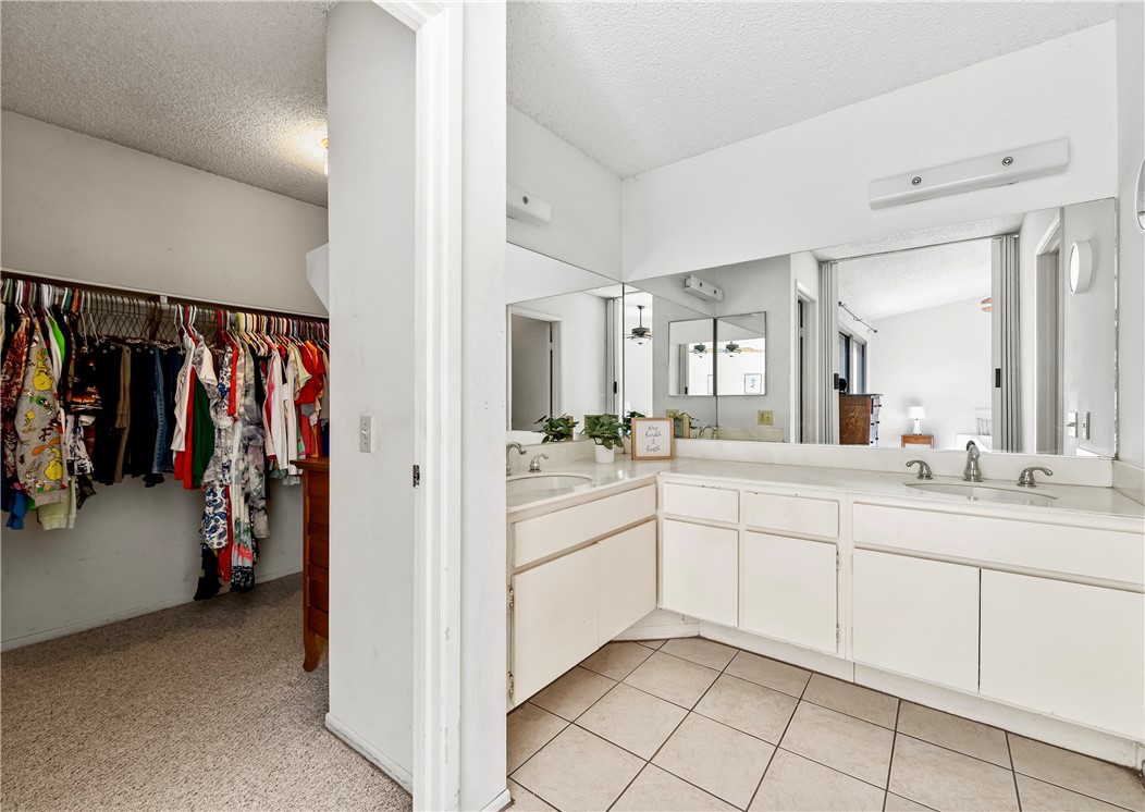 5132 West 1st Street, Unit B Santa Ana, CA 92703 - Photo 21 of 35 a bathroom with a sink and a mirror