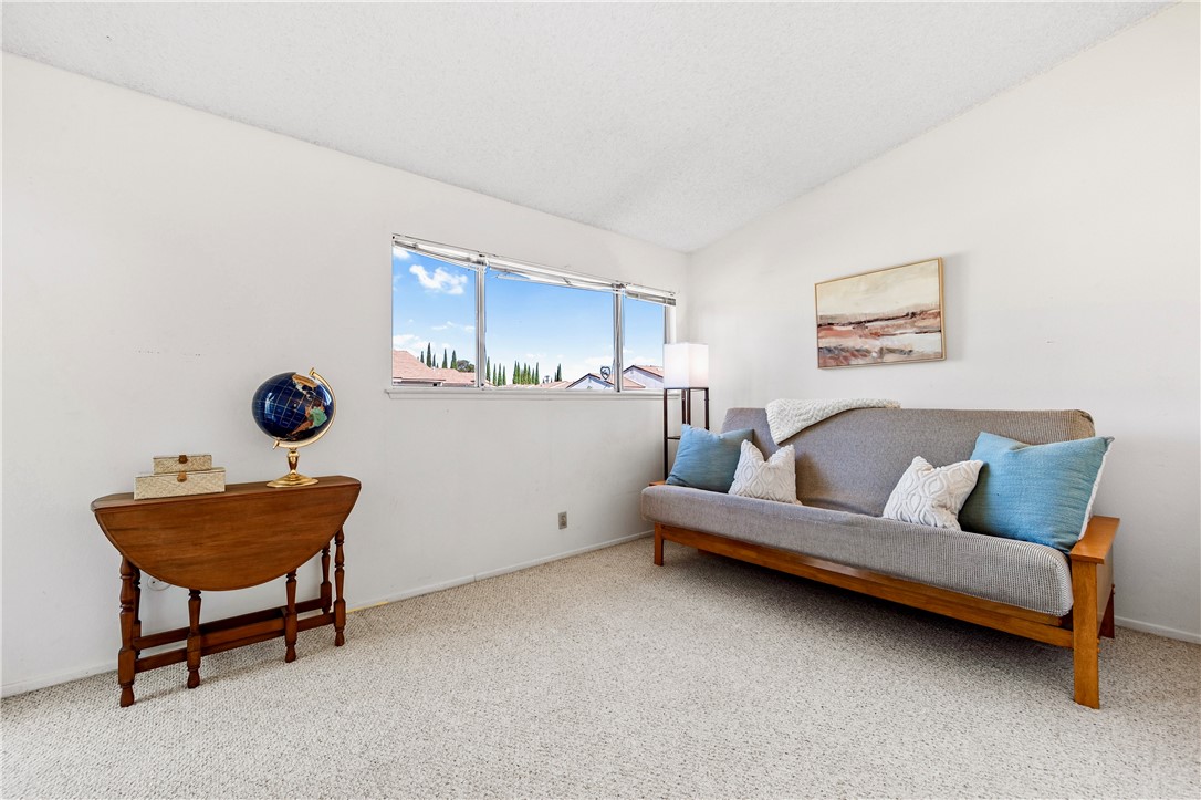 5132 West 1st Street, Unit B Santa Ana, CA 92703 - Photo 23 of 35 a living room with furniture and a window