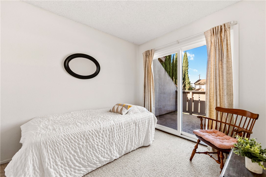 5132 West 1st Street, Unit B Santa Ana, CA 92703 - Photo 28 of 35 a bedroom with a bed and a window