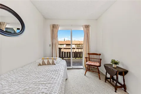 a bedroom with furniture and a window