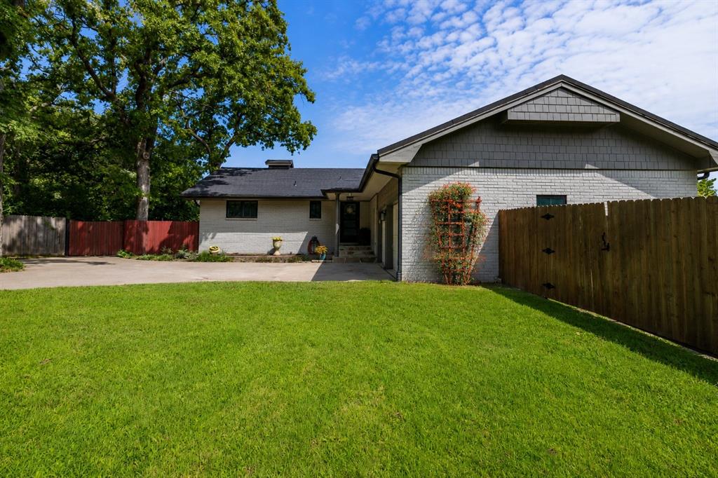 205 Timberlake Drive Azle, TX 76020 - Photo 3 of 40 a front view of a house with swing and plants